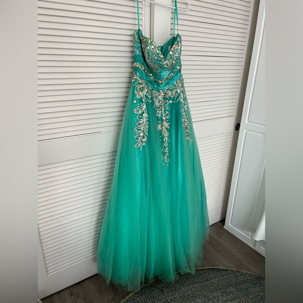 Teal strapless tulle gown with metallic embroidery, gems and beads